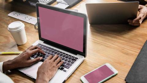 laptop, phone and tablet being used by people