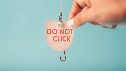 fish hook with do not click written on paper