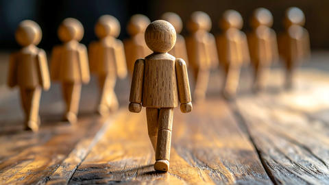 wooden doll stepping in front of others