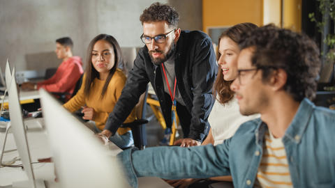 people looking at a laptop screen