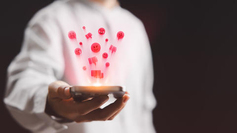 Negative reaction icons floating from a smartphone