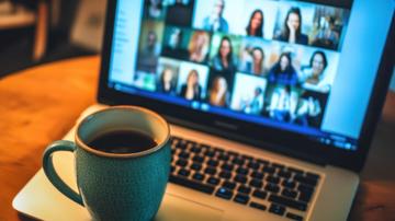 coffee mug sitting on laptop keyboard