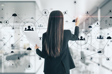 person pointing to a data map on white board