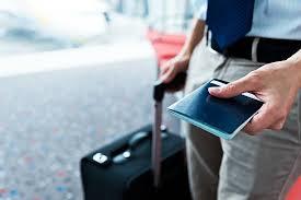 luggage and passport in traveler's hands