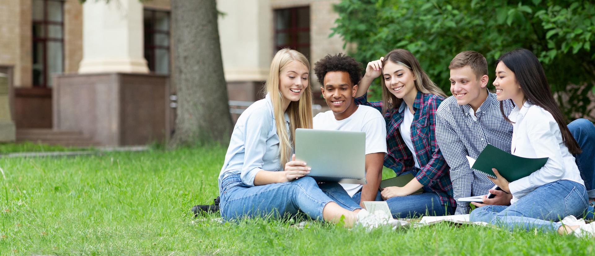 Team of students studying in group project outdoors