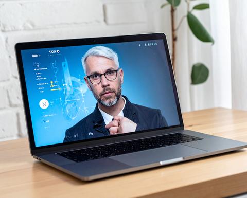 laptop screen displaying a man